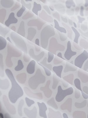 Close-up of brown grey camo stretch printed collarless henley golf shirts, showcasing texture and print details.