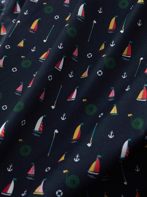 Macro view of the colorful sailboat 4 way stretch print collared polo shirt fabric, showcasing the unique print design
