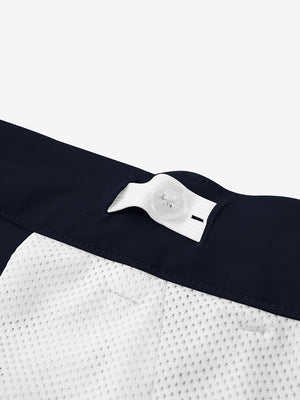 Interior shot of the waistband on the navy youth water resistant cotton blend golf pants, showing inner construction