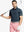 Front half-body shot of model holding golf club wearing Ventilated Heather Jacquard Polo – JUNGLE GREEN HEATHER