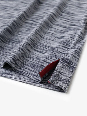 Close-up of hem slit detail in NAVY HEATHER Cool Heather Texture Polo