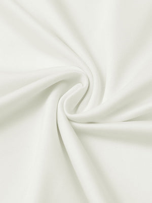 Close-up of cream everyday solid jersey polo fabric showing soft knit texture and smooth surface.