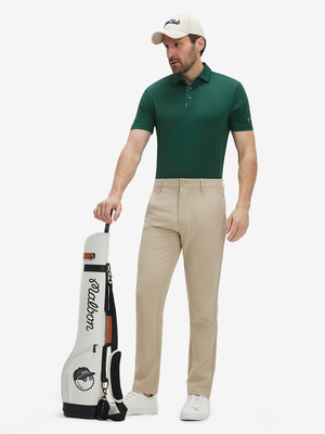 Full-body shot of a model wearing the blackish green everyday classic solid polo, showing the complete casual look