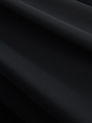 Close-up of black Moisture-Wicking Short Sleeve Henley Shirt fabric texture.
