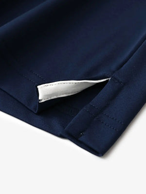 Close-up of hem slit detail in NAVY Premium Performance Polo