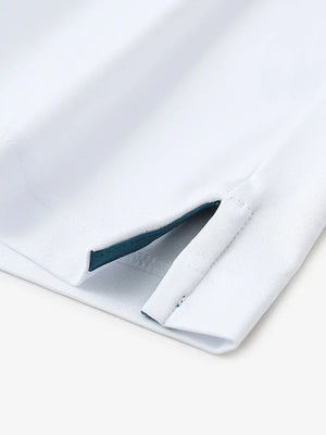 Close-up of hem slit detail in WHITEDUSTY BLUE Premium Performance Polo