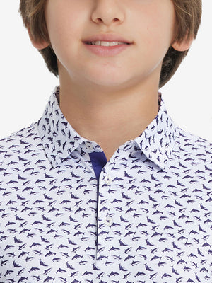Front view of youth wearing white purple shark performance print boys golf polo, showing collar and chest fit